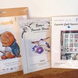 Assortment of Cross Stitch and Quilt designs.  All New